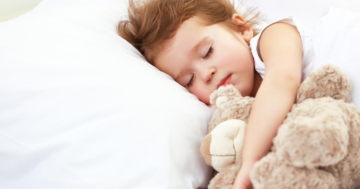 Image of sick girl with teddy bear